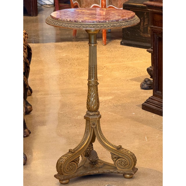 A beautiful Giltwood side table. Drinks or a lamp or maybe flowers on top.