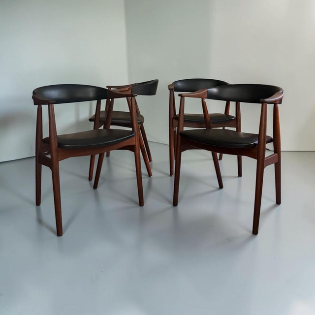 A beautiful set of four Model 213 dining chairs, designed by Danish designer Thomas Harlev. The chairs feature an elegant...