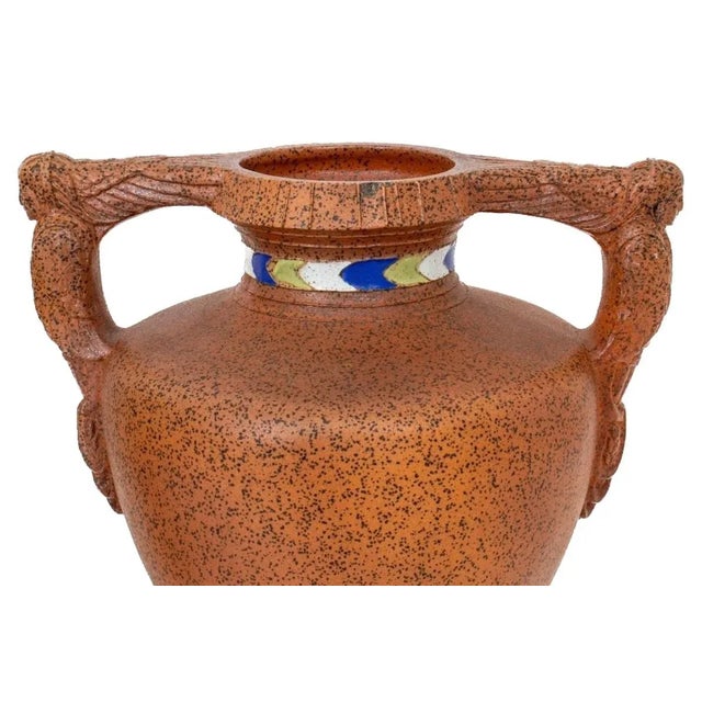 Egyptian revival Art Deco style faux porphyry hand decorated pair two handled decorative piece / vase. Each vase features...