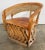 Vintage Mexican Equipale seasoned leather chair crafted from branches bent to form a barrel back frame and reinforced with...