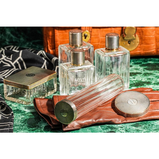 An extraordinary example of early 20th-century French luxury, this Art Deco sterling silver and cut crystal vanity set...