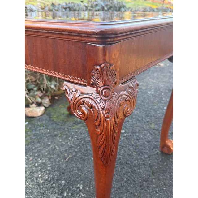 Lovely Chippendale carved end table lat with striking flame mahogany top.The table stands on beautifully carved cabriole...