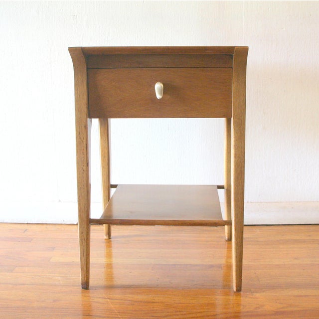 This is a mid century modern side end table nightstand from Drexel's Profile series, designed by John Van Koert. It has...