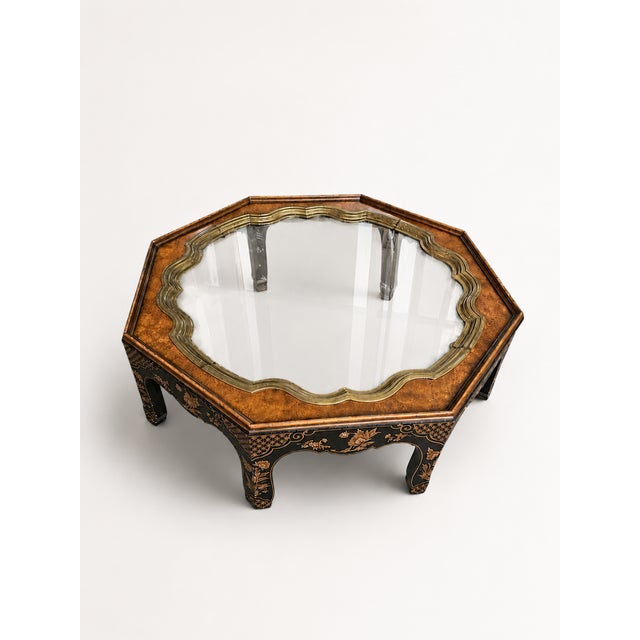 A striking vintage octagonal coffee table that blends elegant form with exquisite Chinoiserie detailing. The standout...
