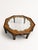 A striking vintage octagonal coffee table that blends elegant form with exquisite Chinoiserie detailing. The standout...