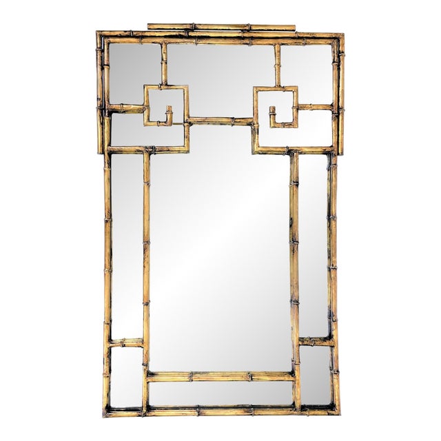 This is an La Barge gilt metal faux bamboo mirror with a Greek key fretwork design. La Barge is known for their quality...