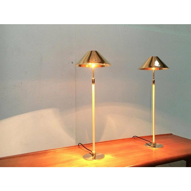 Impressive mid-century table lamps. An elegant design with high-quality materials and workmanship. The flat shade and the...