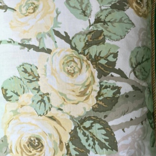Full blown yellow roses in glorious shades of daisy, cream and gold hang from a branch wound with rosy taupe and white...