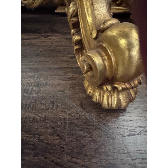 A truly spectacular monumental Italian Rococo Revival console and matching mirror, richly decorated with scrolling...