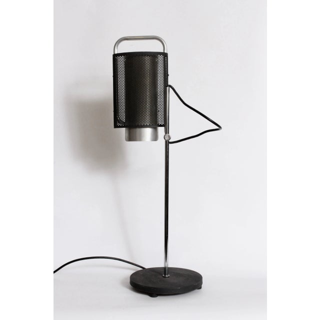 Modern George Nelson for Koch & Lowy Adjustable Perforated Black Table Lamp. Featuring a perforated Black enameled...