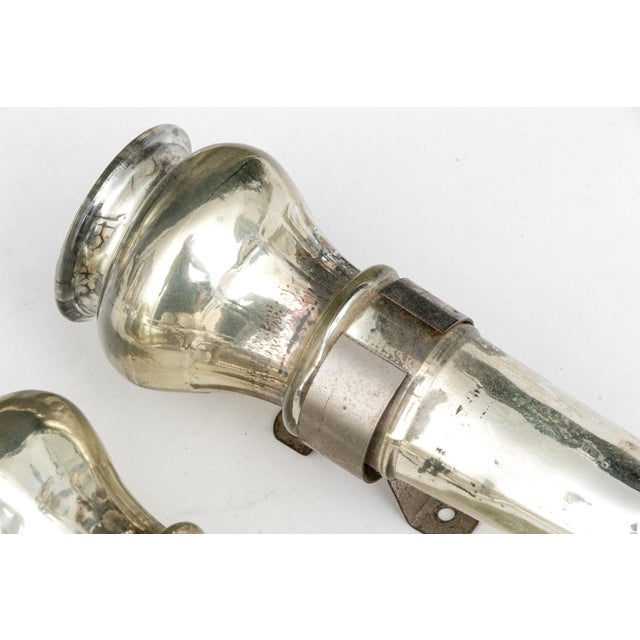 A pair of antique slivered glass wall candle sconces (also known as "mercury glass”) with bulbous ends, tapered fluted...