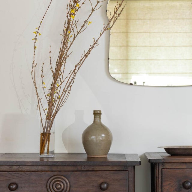 Unique ceramic stoneware tokkuri bottle from Japan, 1960s. Wabi-sabi vessel with warm olive ash glaze over an iron-rich...