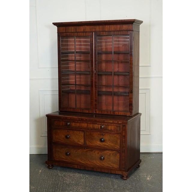 Antique Dresser Bookcase Display Cabinet On A Chest Of Drawers with A Black Leather Top, with Adjustable Shelves. This is...
