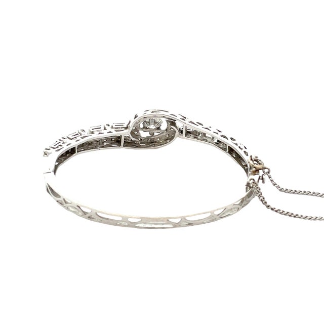 Elegant vintage bracelet crafted in solid 14K white gold. Total Weight: 14.6gm. Size: 6.5". Featuring a graceful swirl...