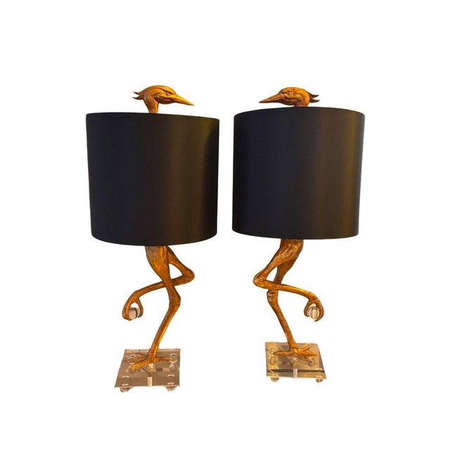 Elegant set of two Ibis table lamps by Cyan Design, featuring sculptural ibis bird forms with refined detailing. Finished...