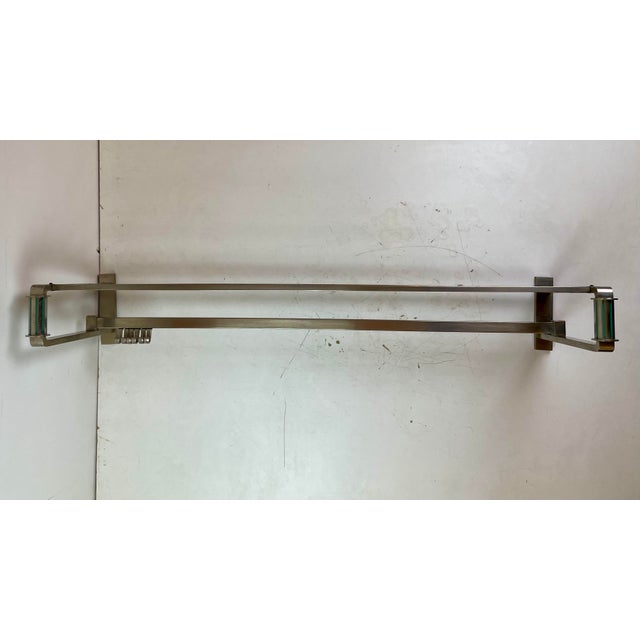 Elegant Art Deco coat rack inspired by the luggage racks and coat rails found in luxury railway carriages of the 1930s....