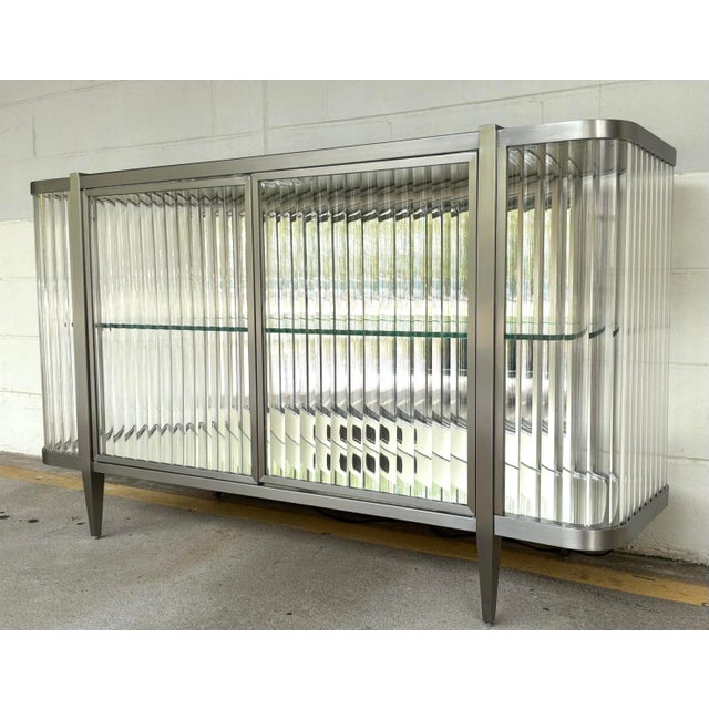 Original retail $8095, stylish Caracole Modern Acrylic and Sati Nickel Light Up Stop and Stare Sideboard, mirrored top and...