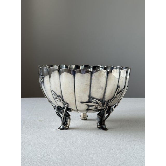 Decorative, heavy alpaca bowl with three legs shaped like bamboo, a motif characteristic of Asian aesthetics. The piece...