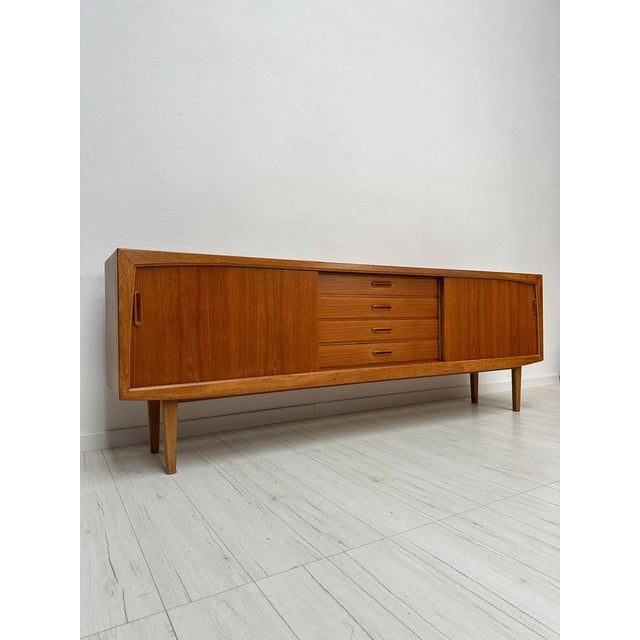 Beautiful vintage credenza from the 1960s. Made in Denmark. Crafted in high-quality teak wood, this spacious sideboard...
