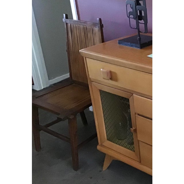 A compelling pair of antique Chinese Southern Official’s Hat armchairs (Nanguanmaoyi), exemplifying the 'vernacular' or...