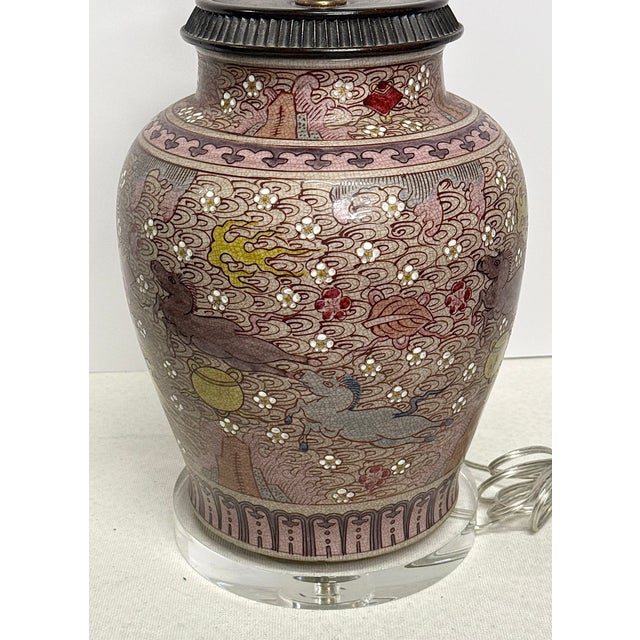 Distinctive crrackle-glaze porcelain lamp with purples, yellows, chartreuse, and pinks. Horse motifs surround the lamp...