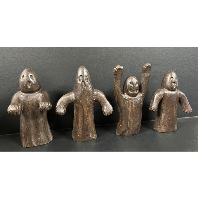 ITEM NAME: Set of 4 Folk Art Carved Wood Ghost Sculpture ORIGIN: Philippines AGES: Late 20th Century MATERIALS: Wood...