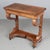 A 19th century French Louis-Philippe console made of solid walnut and veneer of walnut. Sculptural scrolled front legs...