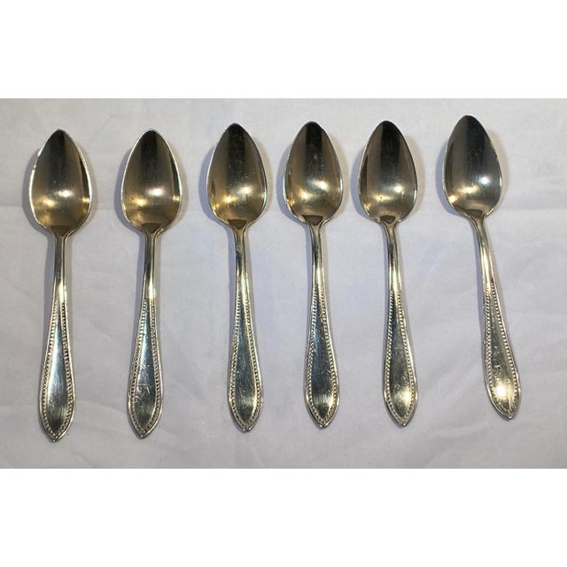 Antique German Gebrueder Henninger (Henninger Bros.) Set of Six “Alpacca” Demitasse Spoons with Case. This sweet set was...