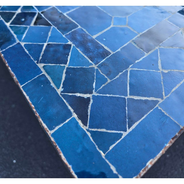 A new arrival. 100 % glazed rectangular. Petrol blue Moroccan mosaic dining table measuring approximately 32" in width and...