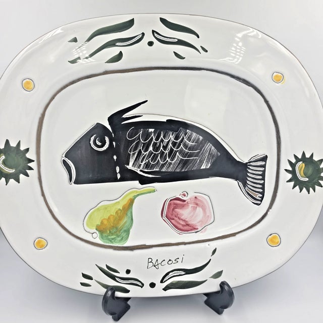 Exceptional vintage Italian ceramic platter from Deruta, featuring the **“Maestro” design by Manlio Bacosi** and signed...
