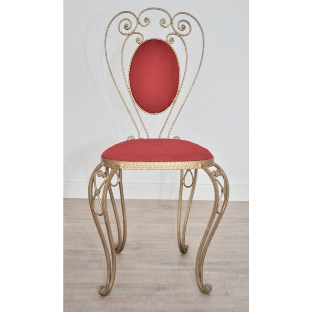 Beautiful wrought iron pieces of chairs made by hand. Painted brass. Red velvet fabric.