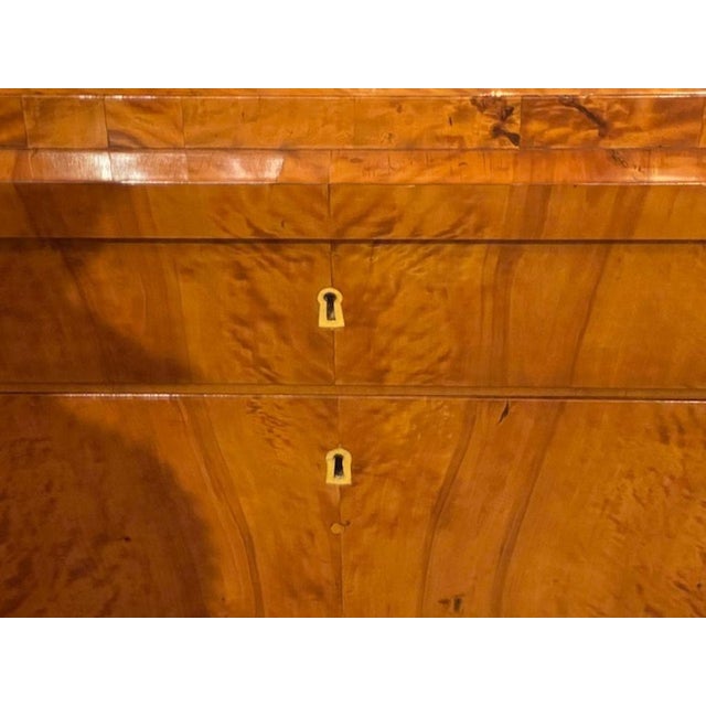 The 19th c. German Biedermeier Maple Commode is a genuine, original antique piece . This commode, exudes the classic and...