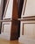 A pair of monumental wooden obelisks with paneled plinth bases and tall, tapered upper forms. At 75 inches in height,...