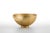 The Intuizioni bowl in satin brass has an Aghi Orizzontale texture.