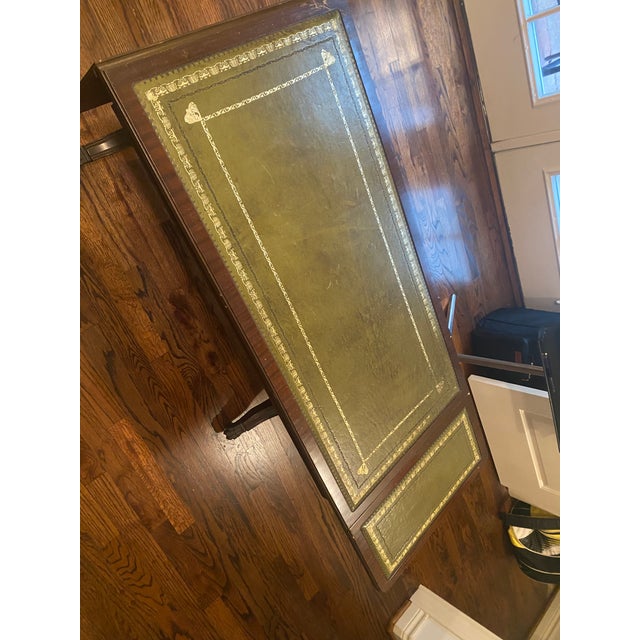 Wood, leather, metal hardware made in England. Mahogany/brown color wood, deep green and gold. Style : english traditional...