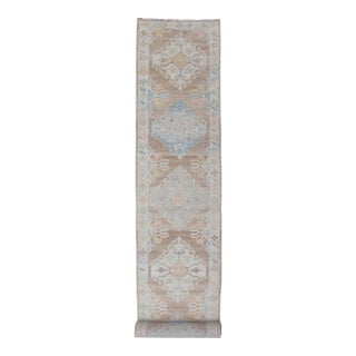 Long Turkish Oushak Runner With Pale Blue, Soft Yellow, and Light Brown Motifs For Sale