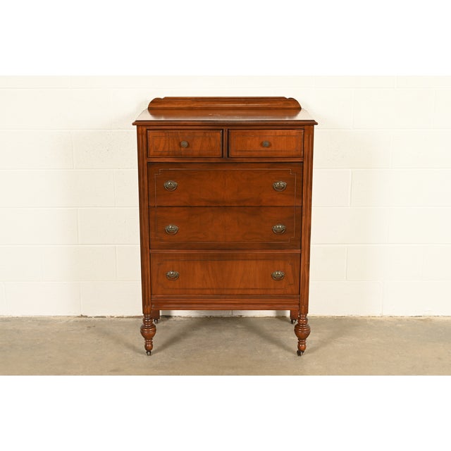 An exceptional French Regency Louis XVI style highboy dresser or chest of drawers In the manner of Berkey and Gay USA,...