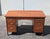 Beautiful Mid-Century Modern walnut desk by Lane, circa 1960s, featuring a warm walnut finish, elegant brass pulls, and a...