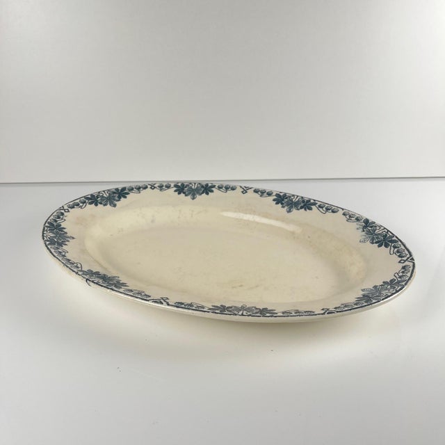 Oval platter, "Tunis" pattern, by Longwy, late 19th century. Blue tones Dimensions: 37 x 25 cm Height: 4 cm Antique item...