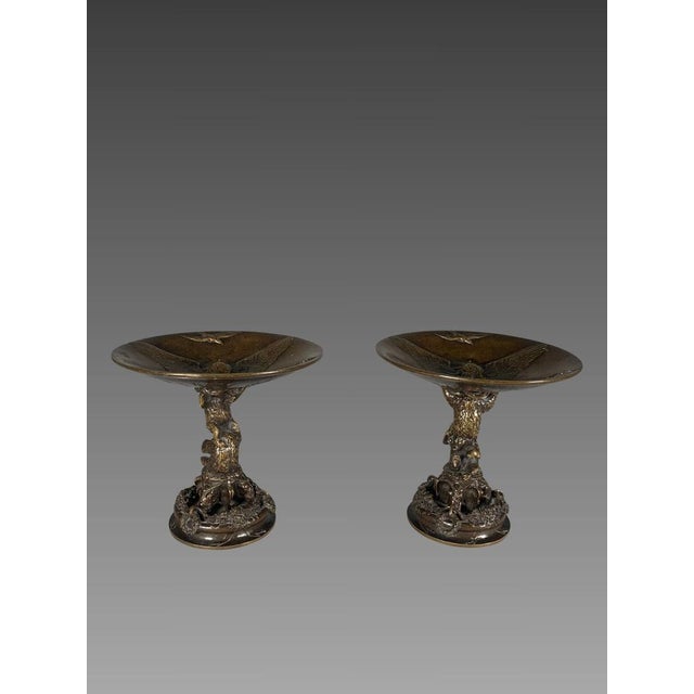 Christophe Fratin (1801-1864) Pair of bronze cups known as "Bear Cups," with a brown patina. The stems depict acrobatic...