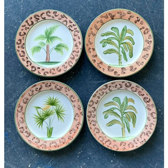 This striking set of eight vintage Italian ceramic salad plates is a masterful celebration of 1980s Hollywood Regency...