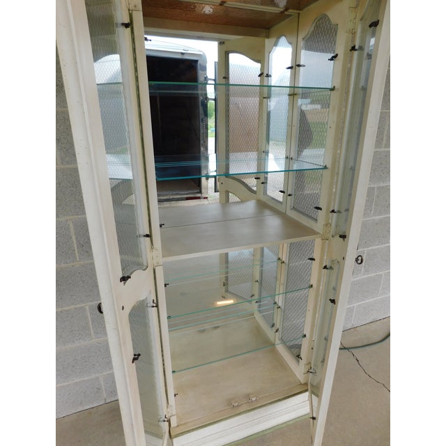 Hekman French Country Style Alabaster Lime Green Lighted Curio Cabinet 1 Pc design features 2 doors, with 4 adjustable...