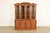 A beautiful French Regency Louis XVI style lighted breakfront bookcase or dining cabinet By Thomasville USA, 1980s Carved...