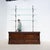 Antique oak and fir display stand, consisting of a low cabinet with two sliding doors and a tall cast iron frame. The...