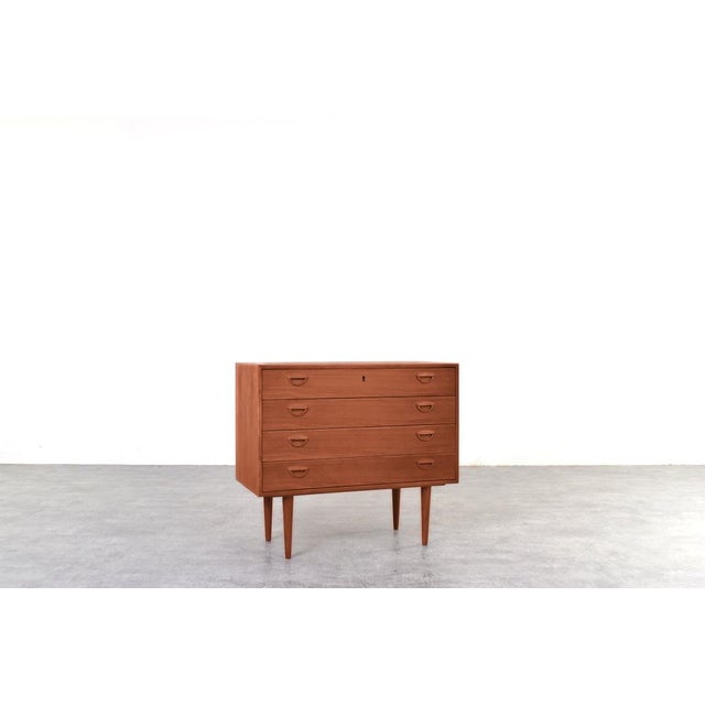 A teak chest of drawers designed by kai kristiansen and produced in the 1960s by the danish company feldballes...