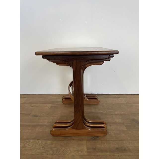 An elegant mid-century nest of tables by g plan, crafted in britain during the 1960s. This versatile set features three...