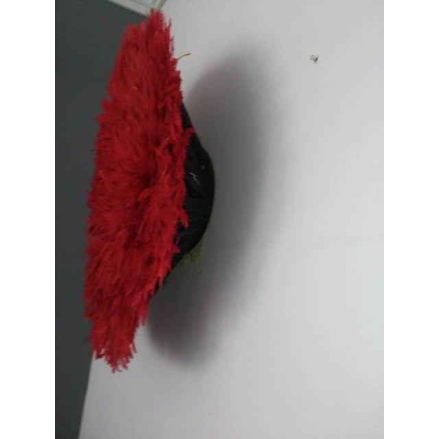 Juju hat red of 24" (60 cm). Juju hat made with natural feathers and rattan. Juju hat woven and handcrafted. Beautiful...