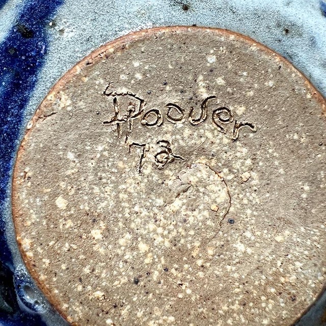 A petite earthenware ceramic bowl. This small vessel will be a great addition to a coffee table used as a vase, or a side...