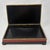 Vintage Chinese carved cinnabar lacquered box. The lid showcases an intricately detailed relief landscape with cranes,...