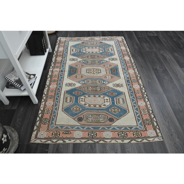 Vintage Turkish Hand-Knotted vintage rug is a semi-antique vintage area rug. The '70s Eastern region of Turkey's unique...